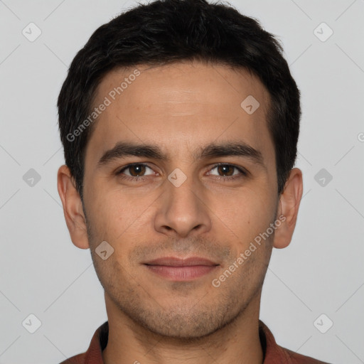 Joyful white young-adult male with short  black hair and brown eyes