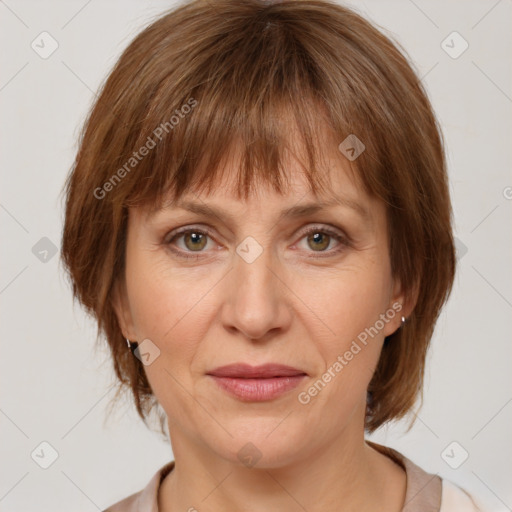 Joyful white adult female with medium  brown hair and grey eyes