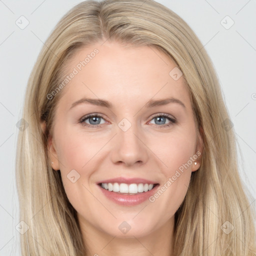 Joyful white young-adult female with long  brown hair and blue eyes