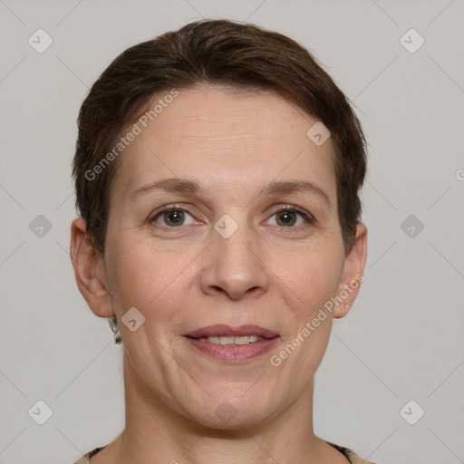 Joyful white adult female with short  brown hair and grey eyes