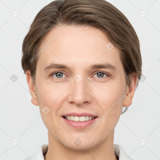 Joyful white young-adult female with short  brown hair and grey eyes