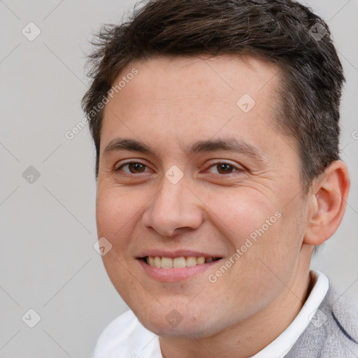 Joyful white young-adult male with short  brown hair and brown eyes