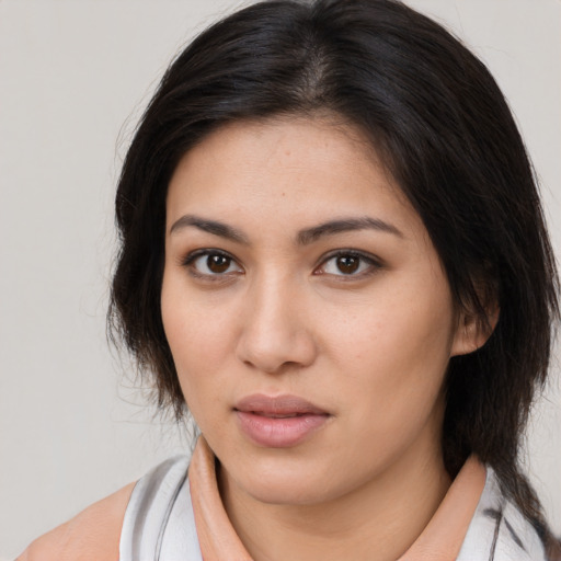 Neutral latino young-adult female with medium  brown hair and brown eyes