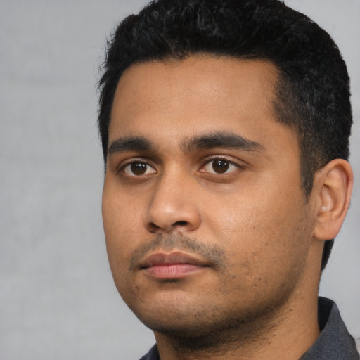 Neutral latino young-adult male with short  black hair and brown eyes