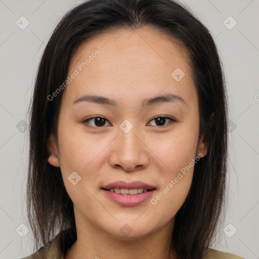 Joyful asian young-adult female with medium  brown hair and brown eyes