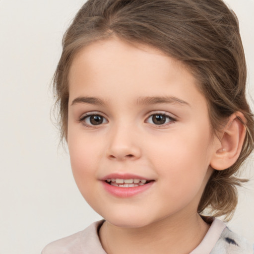 Joyful white child female with medium  brown hair and brown eyes