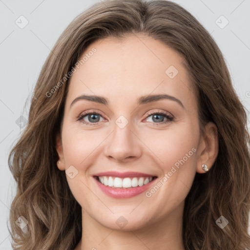 Joyful white young-adult female with long  brown hair and green eyes