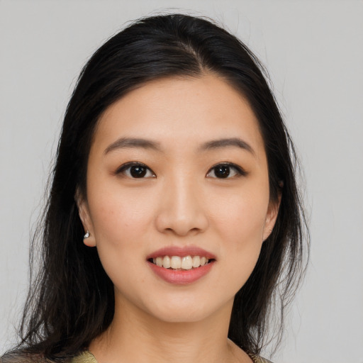 Joyful asian young-adult female with medium  black hair and brown eyes
