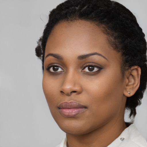 Neutral black young-adult female with short  black hair and brown eyes