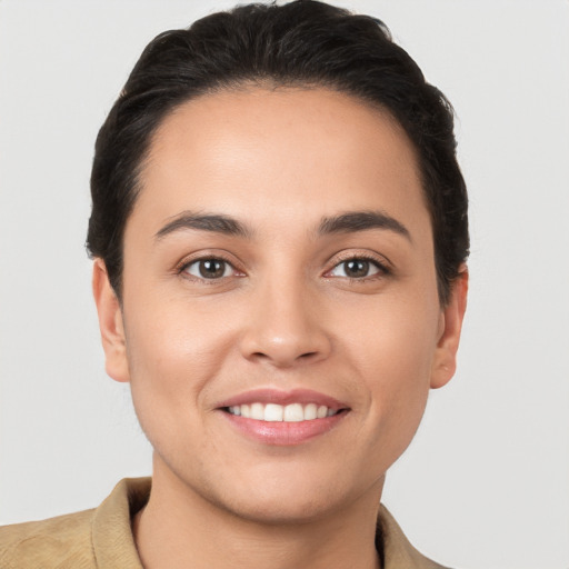 Joyful white young-adult female with short  brown hair and brown eyes