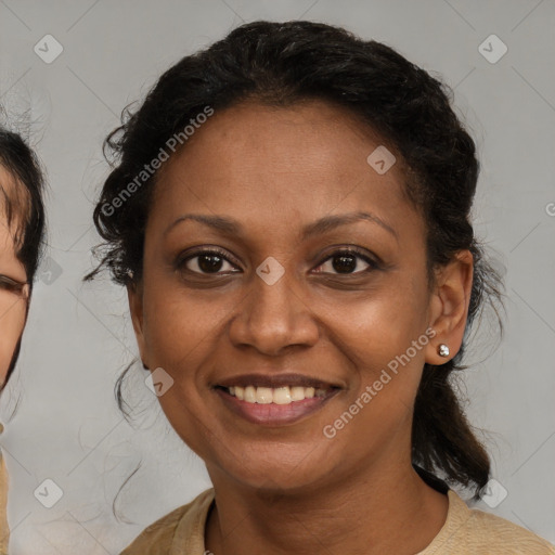 Joyful latino adult female with medium  brown hair and brown eyes