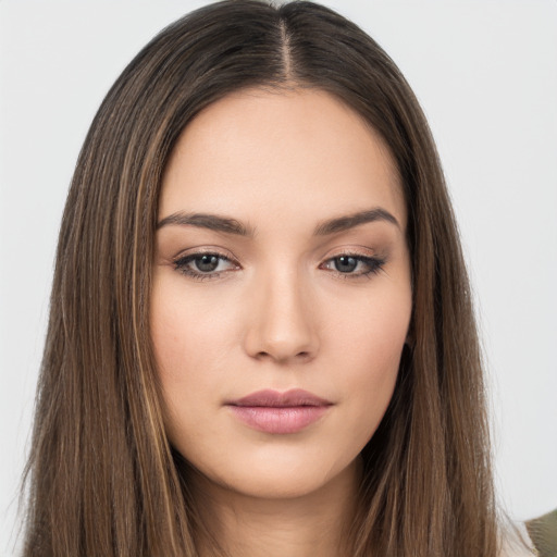 Neutral white young-adult female with long  brown hair and brown eyes