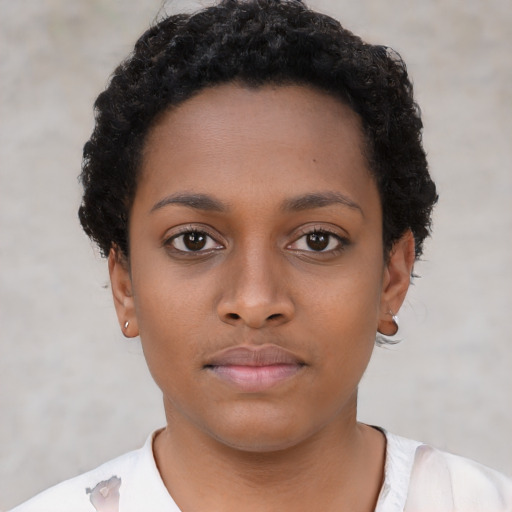 Neutral black young-adult female with short  black hair and brown eyes