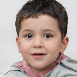 Joyful white child male with short  brown hair and brown eyes