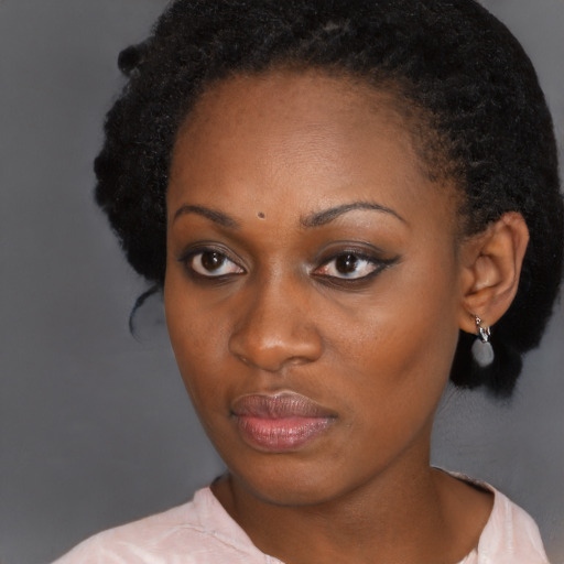 Neutral black adult female with short  black hair and brown eyes