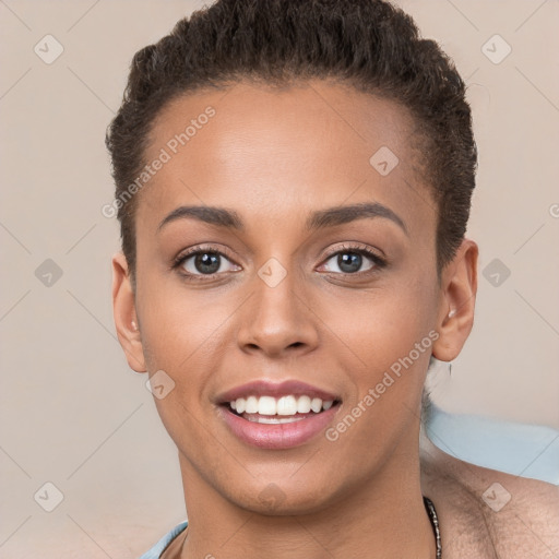 Joyful white young-adult female with short  brown hair and brown eyes