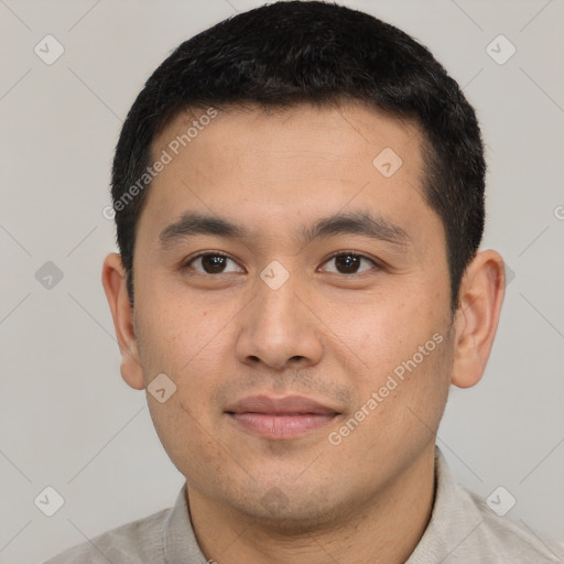 Joyful latino young-adult male with short  black hair and brown eyes