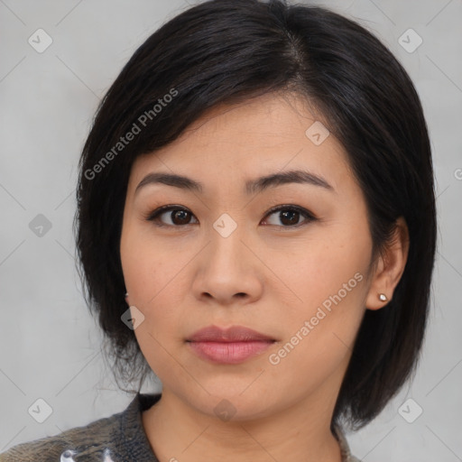 Joyful asian young-adult female with medium  black hair and brown eyes