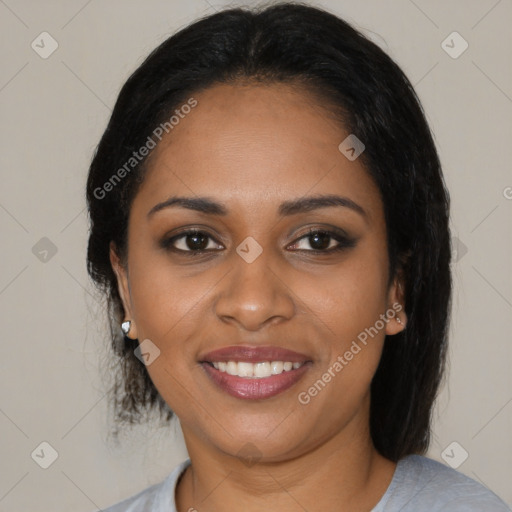 Joyful black young-adult female with medium  brown hair and brown eyes