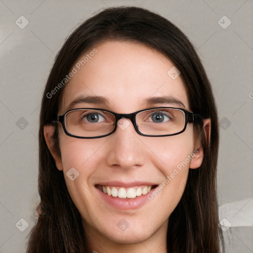 Joyful white young-adult female with long  brown hair and green eyes