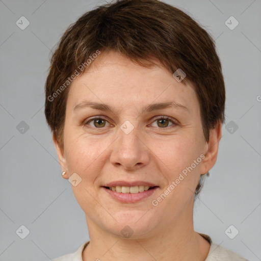 Joyful white adult female with short  brown hair and grey eyes