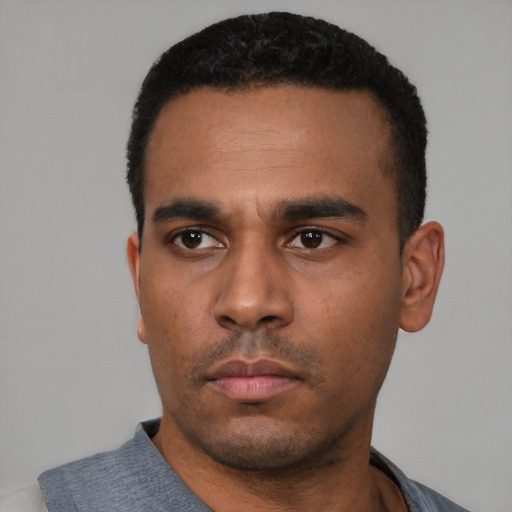 Neutral latino young-adult male with short  black hair and brown eyes