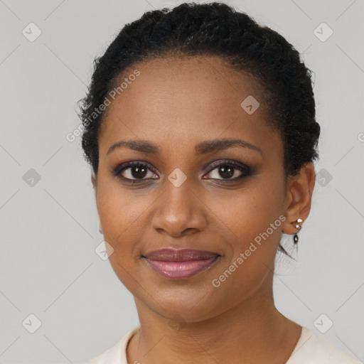 Joyful black young-adult female with short  brown hair and brown eyes