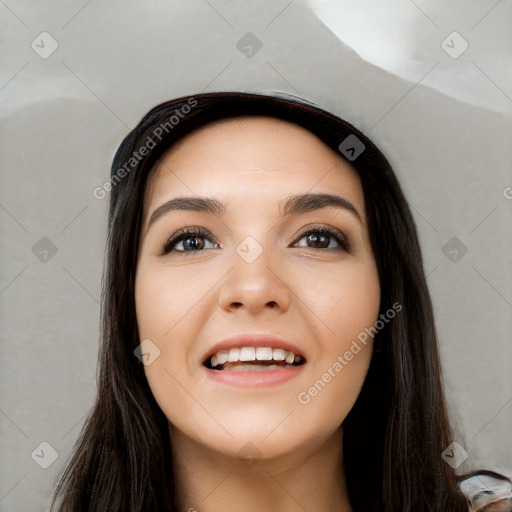 Joyful white young-adult female with long  black hair and brown eyes