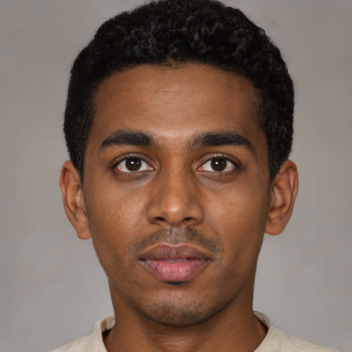Neutral latino young-adult male with short  black hair and brown eyes
