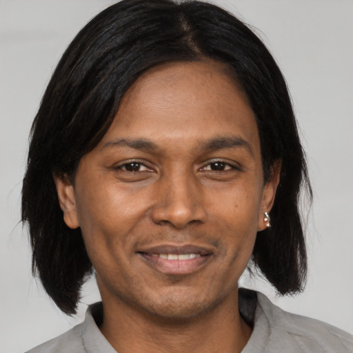 Joyful asian adult male with medium  black hair and brown eyes