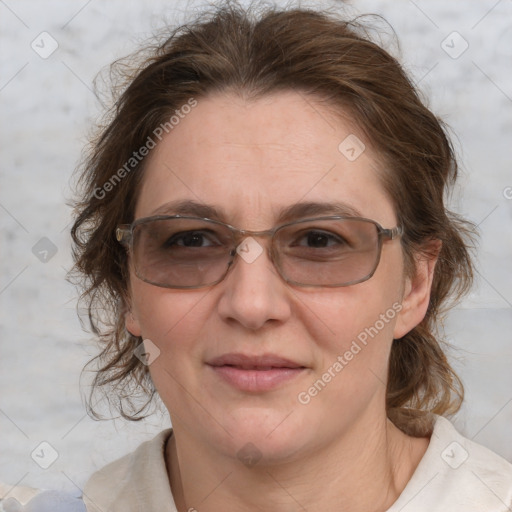 Joyful white adult female with medium  brown hair and blue eyes