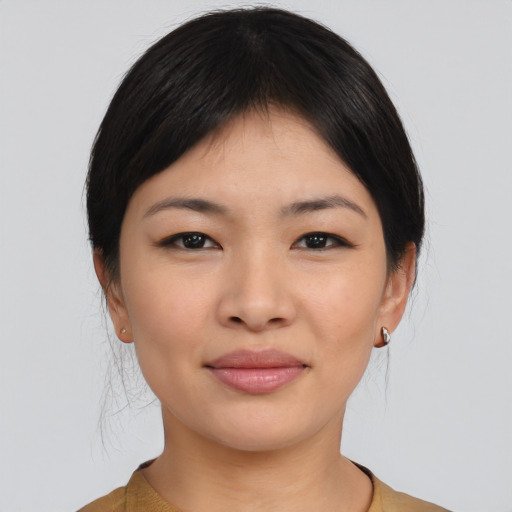 Joyful asian young-adult female with medium  black hair and brown eyes