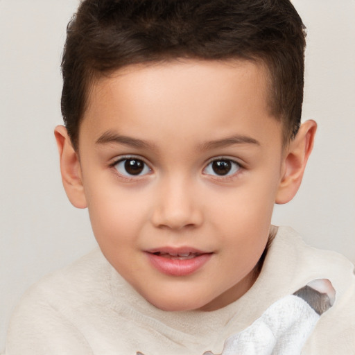 Joyful white child male with short  brown hair and brown eyes