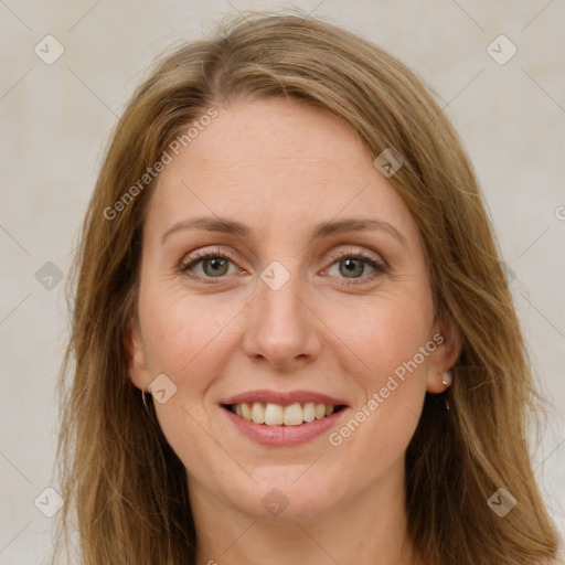 Joyful white young-adult female with long  brown hair and green eyes