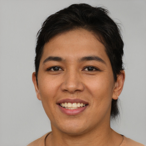 Joyful asian young-adult female with short  brown hair and brown eyes