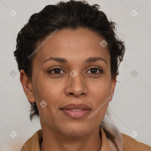 Joyful black adult female with short  brown hair and brown eyes