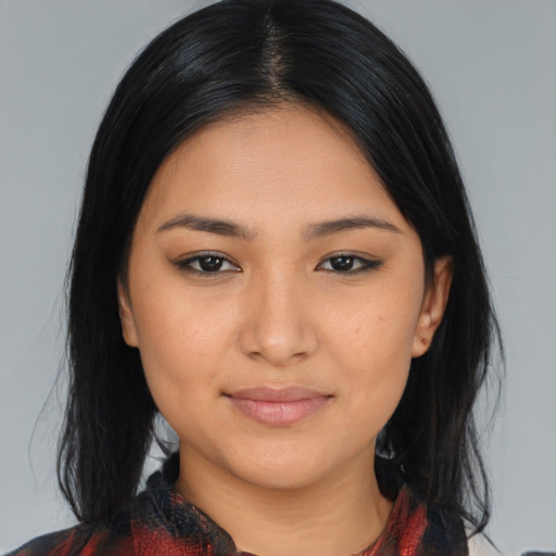 Joyful asian young-adult female with medium  black hair and brown eyes