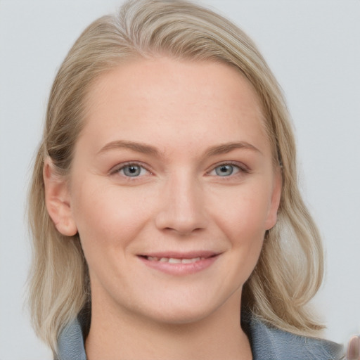 Joyful white young-adult female with medium  brown hair and blue eyes