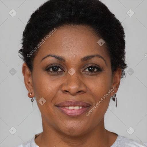 Joyful black adult female with short  brown hair and brown eyes