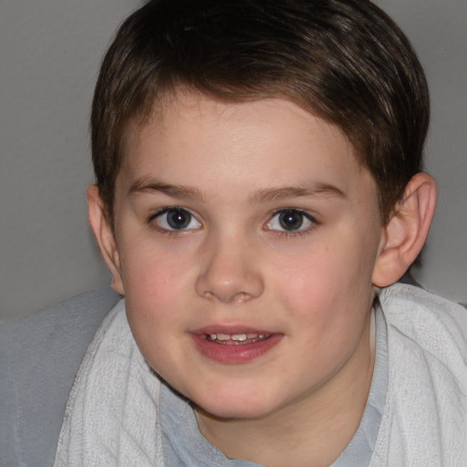 Joyful white child female with short  brown hair and brown eyes