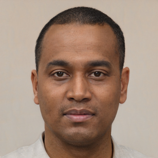 Neutral black young-adult male with short  black hair and brown eyes