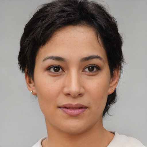 Joyful asian young-adult female with short  black hair and brown eyes