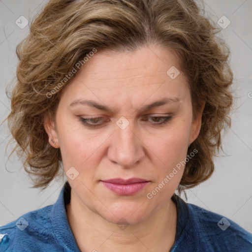 Joyful white adult female with medium  brown hair and blue eyes