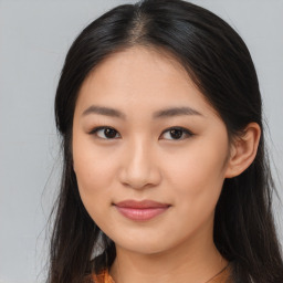 Joyful asian young-adult female with long  brown hair and brown eyes