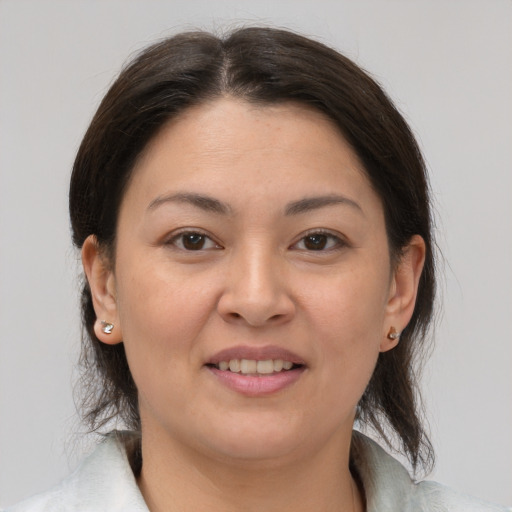 Joyful white young-adult female with medium  brown hair and brown eyes