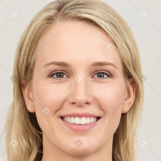 Joyful white young-adult female with long  brown hair and blue eyes