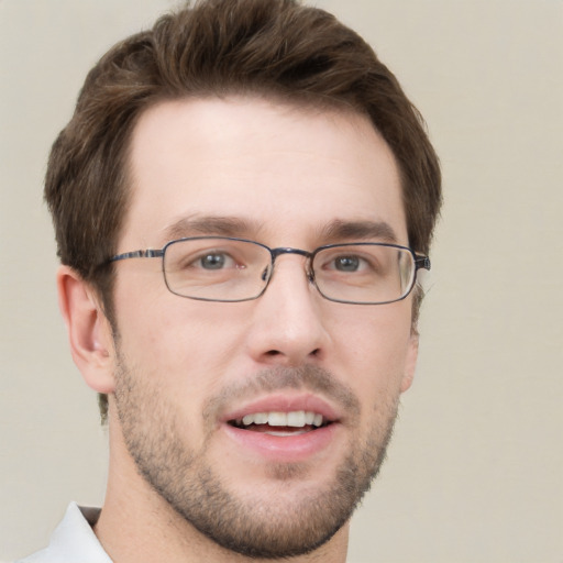 Joyful white young-adult male with short  brown hair and green eyes