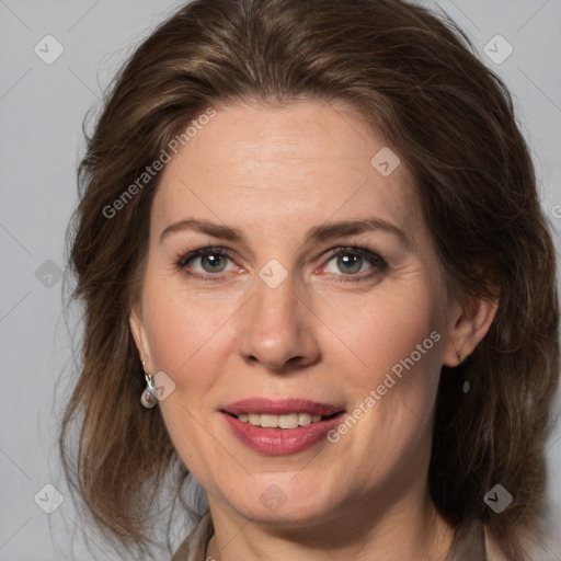 Joyful white adult female with medium  brown hair and grey eyes