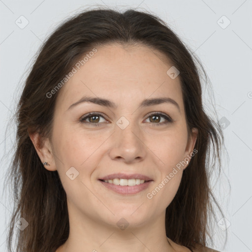 Joyful white adult female with long  brown hair and brown eyes