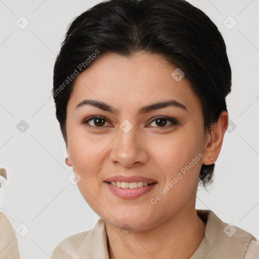 Joyful latino young-adult female with short  brown hair and brown eyes